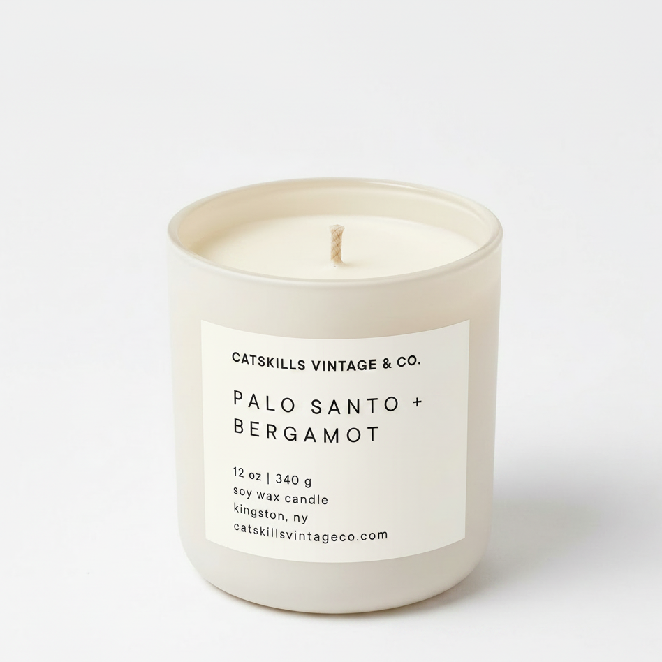 Palo Santo + Bergamot 12 oz soy candle in cream matte glass jar