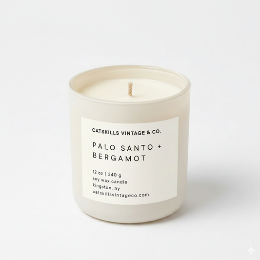 Palo Santo + Bergamot 12 oz soy candle in cream matte glass jar