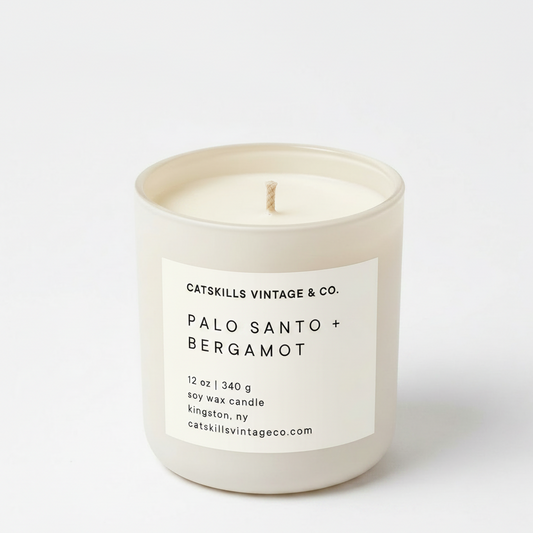 Palo Santo + Bergamot 12 oz soy candle in cream matte glass jar