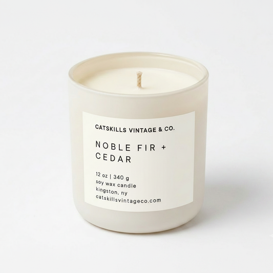Noble Fir + Cedar 12 oz soy candle in cream matte glass jar