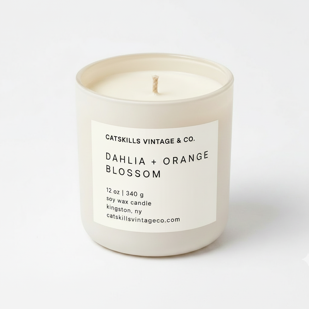 Dahlia + Orange Blossom 12 oz soy candle in cream matte glass jar
